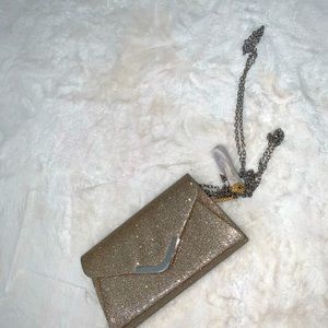 Women’s gold sparkly chain clutch purse